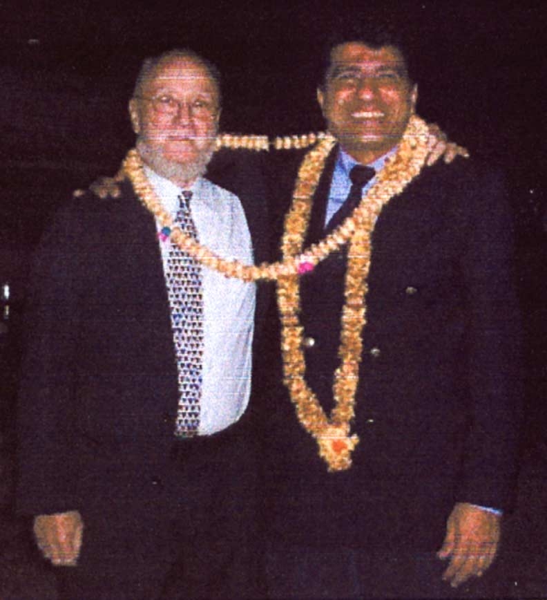 Mohamed El Naschie (of the Moslem faith) and David Finkelstein (the great Jewish Mathematical Physicist)
united by flowers.